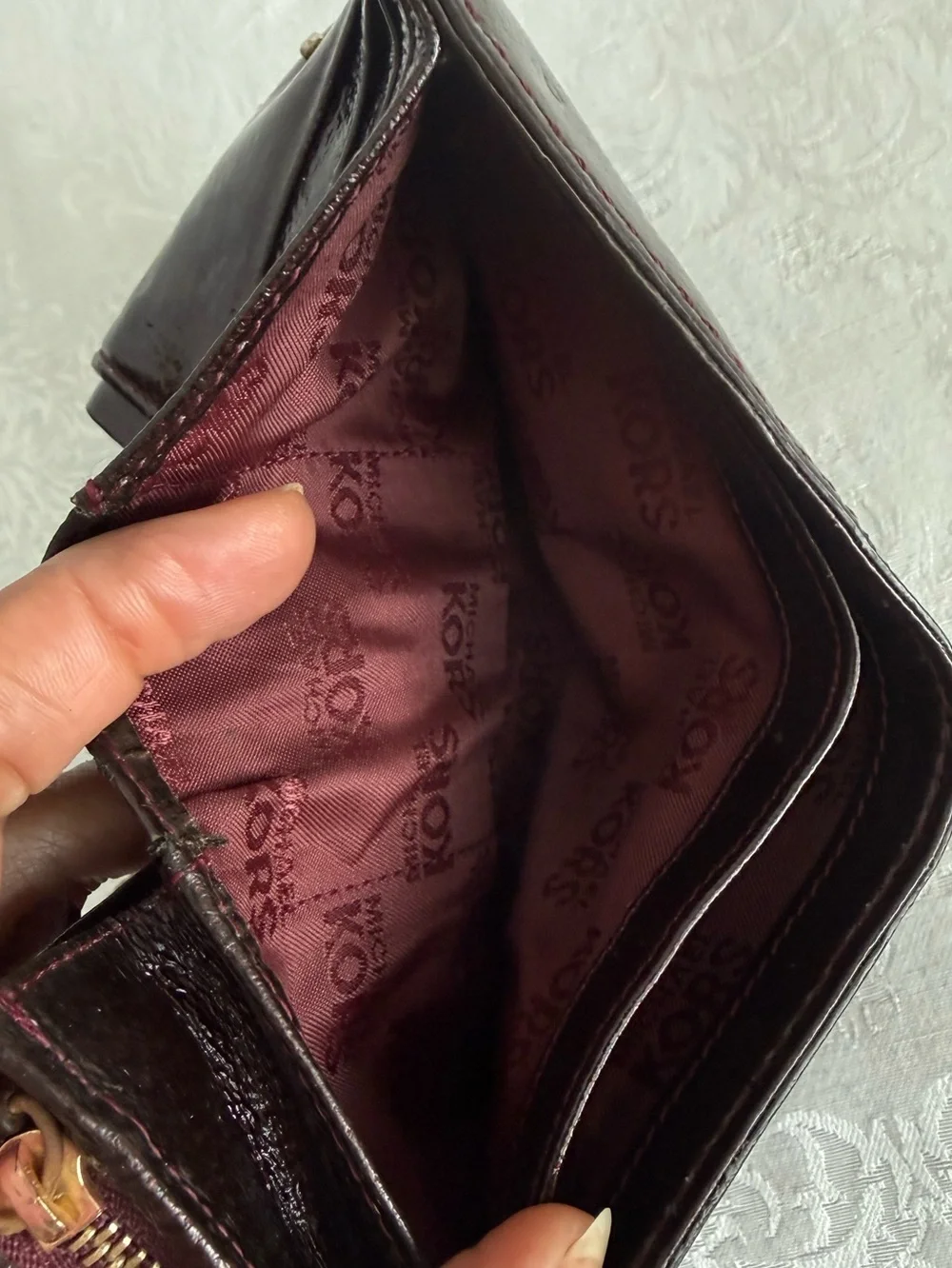 Michael Kors Burgundy patent bifold wallet with Gold Studs